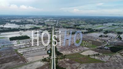 Aerial Panning View The Water Season At Paddy Field - Video Drone Footage