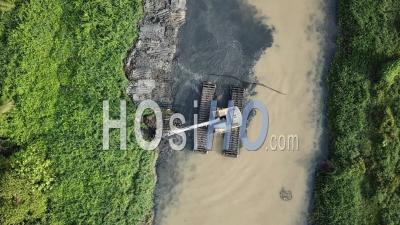 Bird Eye View Excavator Dig The Mud From River - Video Drone Footage
