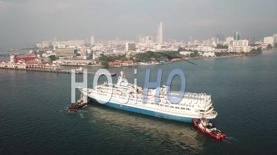 Tugboats Push Cruise Leisure World To Swettenham Pier At Penang Island - Video Drone Footage