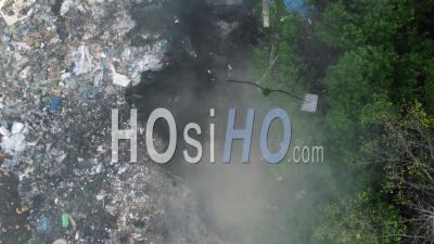 Open Burning Garbage At Dump Site - Video Drone Footage