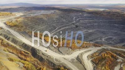 Top View Of An Open Pit For The Extraction Of Iron Ore - Video Drone Footage