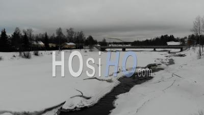 Bridge Over An Icy River - Video Drone Footage