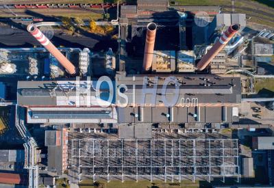 Vertical View Of A Coal-Fired Thermal Power Plant Complex. Three Chimneys, High Voltage Electrical Transmission Station - Aerial Photography
