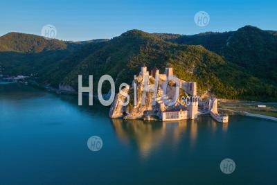 The Medieval Fortress Of Golubac, Mirroring In The Waters Of The Danube. Famous Tourist Place, Serbia. - Aerial Photography