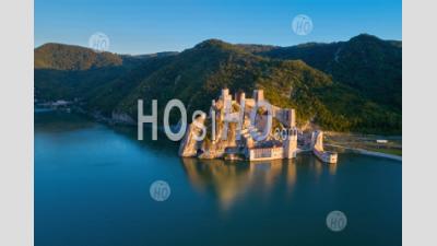 The Medieval Fortress Of Golubac, Mirroring In The Waters Of The Danube. Famous Tourist Place, Serbia. - Aerial Photography