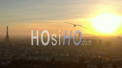 Paris And The Eiffel Tower In The Backlight Of The Morning Sun Filmed From A Helicopter