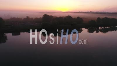 The Banks Of The Saone River In The Morning Mist At Sunrise Near Village Of Tournus, Saone-Et-Loire, Burgundy-Franche-Comte, France - Video Drone Footage