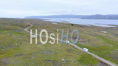 Aerial Drone View Of Car Driving On Roads Of Scottish Highlands, Scotland, On Road Trip Holiday With Beautiful Mountain Landscape Scenery, Nc500 (north Coast 500 Route) Adventure