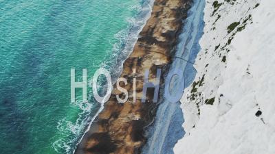 Coastline Aerial Drone Of Ocean Waves Breaking On Sandy Beach By White Chalk Cliffs On Coast Showing Patterns And Beauty In Nature