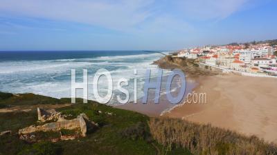 Aerial Drone View Of Portugal Coastal Town With Houses In Housing Market In Sintra, Lisbon, Europe, Cliff Top Properties And Homes On Coast With Sea View At Praia Das Macas Beach