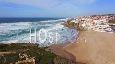 Aerial Drone View Of Portugal Coastal Town With Houses In Housing Market In Sintra, Lisbon, Europe, Cliff Top Properties And Homes On Coast With Sea View At Praia Das Macas Beach