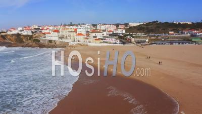 Aerial Drone View Of Sandy Beach At Lisbon, Portugal At Praia Das Macas, A Beautiful Coastal Town On The Atlantic Coast On Top Of A Cliff, A Popular Tourist Destination In Europe