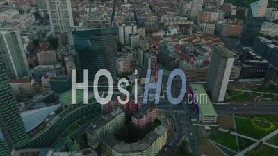 High Angle View Of Modern Buildings In City And Vehicles Driving Or Multilane Road Around. Milano, Italy - Video Drone Footage