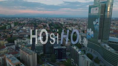 Elevated View Of Buildings In Urban Borough At Twilight. Revealing Modern Design High Rise Office Building. Milano, Italy. - Video Drone Footage