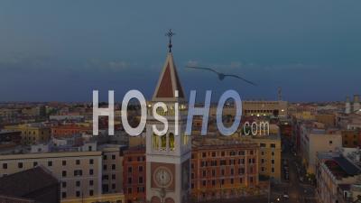 Circular Footage Of Beautiful Tower With Clocks. Church And Apartment Buildings In Background. Historic City At Twilight. Rome, Italy - Video Drone Footage