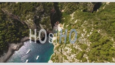 A Bird's-Eye-View Shows Boats Anchored Near Stiniva Beach In Vis, Croatia - Video Drone Footage