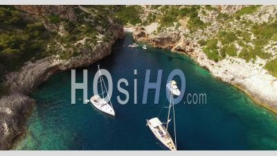 An Aerial View Shows Sailboats And Tourists At Stiniva Beach In Vis, Croatia - Video Drone Footage