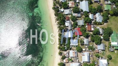 A Bird's-Eye-View Shows Waves Lapping At The Beach Of Yanuya Island, Fiji - Video Drone Footage