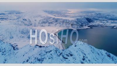An Aerial View Shows Wintry Mountains Near The Coastline Of The Lofoten Islands In Norway - Video Drone Footage