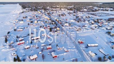 An Aerial View Shows The Colorful Homes Near A Forest In The Wintry Town Of Kiruna, Sweden - Video Drone Footage