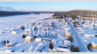 An Aerial View Shows The Colorful Homes Near A Forest In The Wintry Town Of Kiruna, Sweden - Video Drone Footage