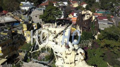 An Aerial View Shows Tourists Exploring The Crazy House Of Dalat, Vietnam - Video Drone Footage