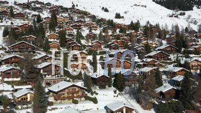 2022 - Excellent Aerial View Of A Residential Area In The Wintry Mountain Town Of Verbier, Switzerland - Video Drone Footage
