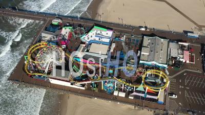 2022 - Excellent Bird's Eye View Of The Amusement Park At Santa Monica Pier - Video Drone Footage