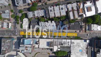 2020 - High Aerial Over The Black Lives Matter Blm Mural On Street Top Down Brooklyn New York - Video Drone Footage