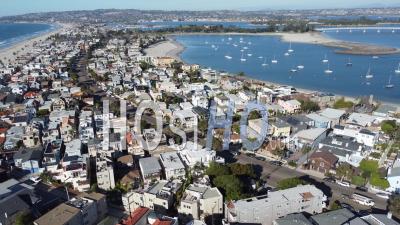 Nice Aerial Over Seaside Condos, And Vacation Homes Along South Mission Beach, San Diego, California - Video Drone Footage