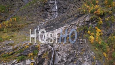 Waterfall In The Mountains In Autumn (vallon De L'onde, On The Edge Of The Ecrins National Park) Hautes-Alpes, Viewed From Drone