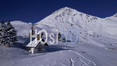 The Chapel Of The Shot Near The Col Du Lautaret (hautes-Alpes) In Winter, Viewed From Drone