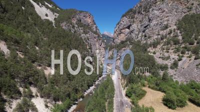 Mountain Road In The Queyras, At The Entrance To The Gorges Du Guil, Hautes-Alpes, France, Viewed From Drone