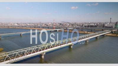 Trains Passing Over The River In Tokyo - Video Drone Footage