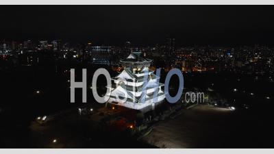 Close Up Aerial Of Osaka Castle At Night - Video Drone Footage