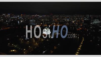 Osaka Castle At Night From A Distance - Video Drone Footage