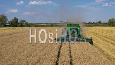 Harvester In Field - Video Drone Footage