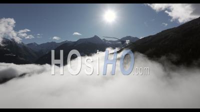 Aerial Shot Of Snow Capped Mountains Ranging Above Clouds In The Austrian Alps Near Gastein, Salzburg - Video Drone Footage