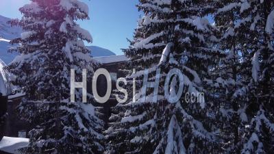 Aerial Shot Of A Ski Resort On A Blue Sky Day - Video Drone Footage