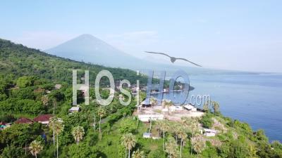 Aerial Shot Of A Bay With A View Of A Volcano In East Bali - Video Drone Footage