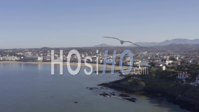 Drone View Of Saint-Jean-De-Luz, The Beach, The Lighthouse, The Harbor, In The Background The Pyrenees