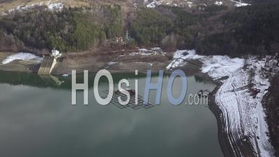Lake Lacul Rosu And Fishermen Floating Houses By Winter - Video Drone Footage