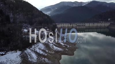 Dam Of Lake Lacul Rosu By Winter - Video Drone Footage