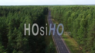 Aerial View Of Road Through The Green Forest. - Video Drone Footage