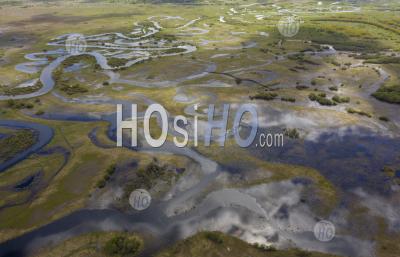 Aerial View Of Red, Yellow And Green Lakes Polluted Toxic Water In Nature. Against The Background Of Clay Hills In Abandoned Open Pit Mine. - Aerial Photography