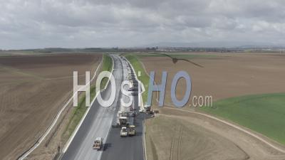 Highway Under Construction With Queue Of Trucks - Video Drone Footage
