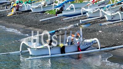 Traditional Fishing Boats On Black Sand Beach In Amed, Bali, Indonesia - Video Drone Footage