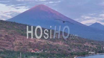 Sunrise Over Agung And Batur Volcanoes From Amed, Bali, Indonesia - Video Drone Footage