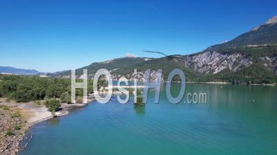 Lake Of The Serre-Ponçon Hydroelectric Dam At Its Maximum Filling Level., Viewed From Drone