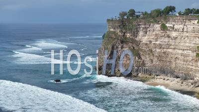 Seashore And Cliffs Nearby Pura Uluwatu Temple, Bali, Indonesia - Video Drone Footage